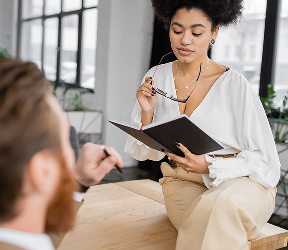 African american businesswoman holding glasse
