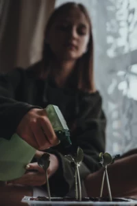 a teenage girl with blond hair sits at home