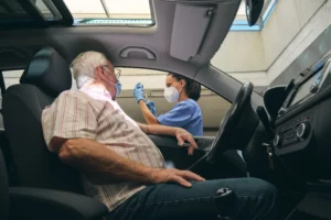 crop nurse filling syringe with vaccine