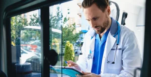 doctor is filling out rescue questionnaire sitting