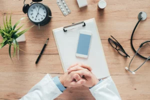 doctor using smartphone app in hospital office