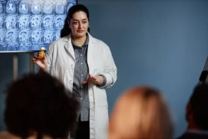 female doctor showing pills during presentation