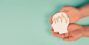 holding a head in the hands mental health concept