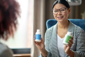 pleasant psychologist wearing glasses recommending