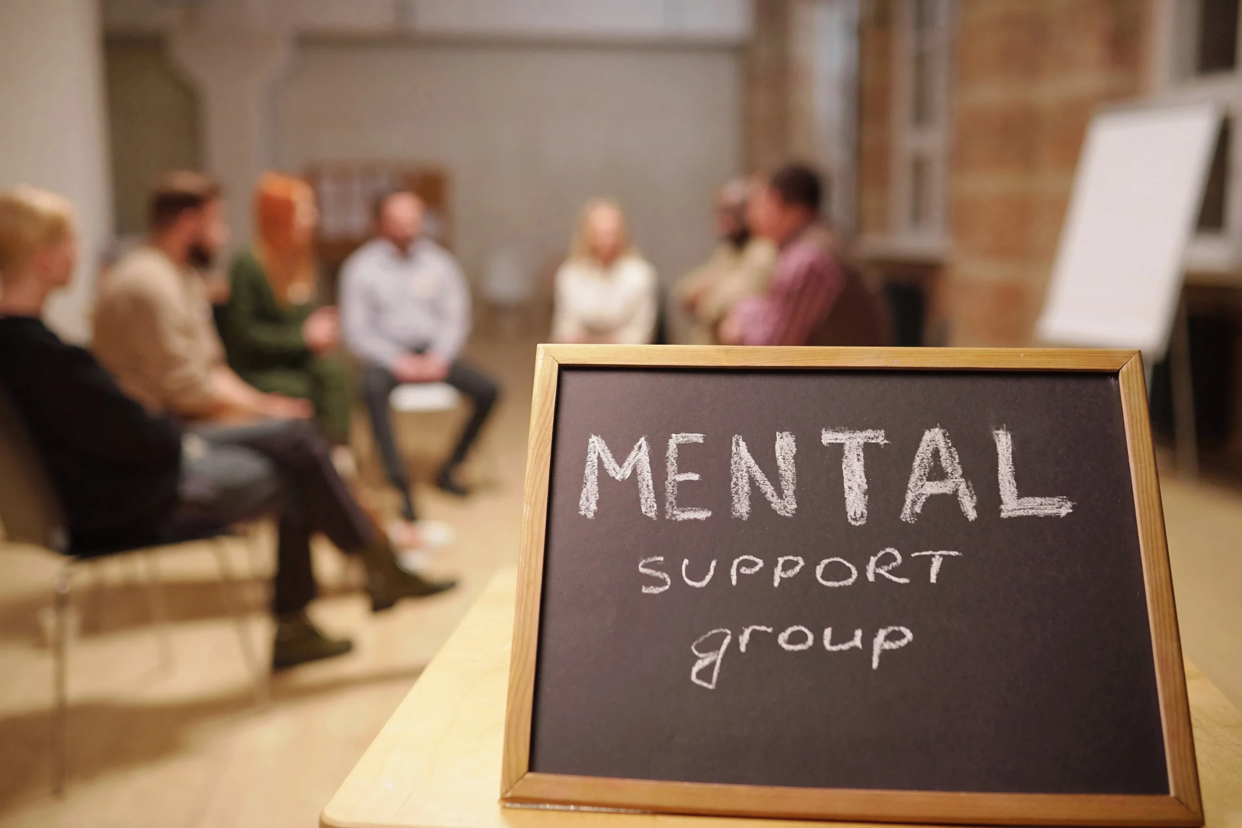 small blackboard with notice saying mental support