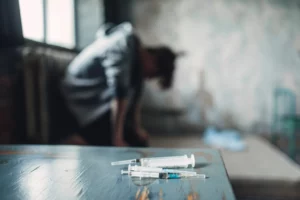 syringe and spoon for dose preparing on the table