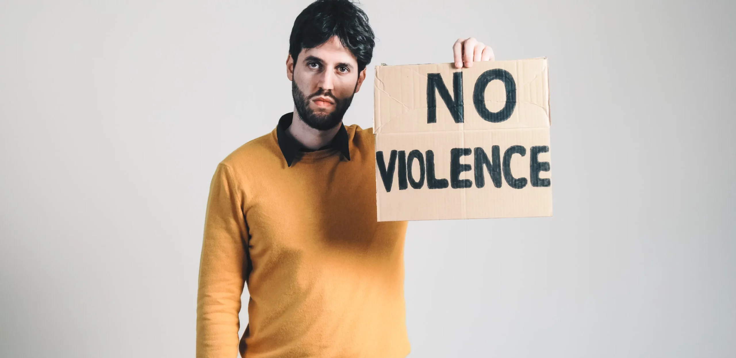 ukrainian boy holding a no violence placard in hand