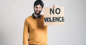 ukrainian boy holding a no violence placard in hand