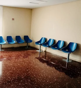 waiting room in a hospital with empty chairs